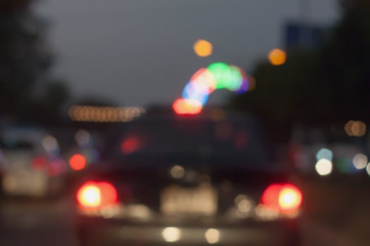 beautiful background of bokeh lights at night on road with car photo