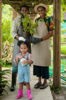 Happy black agronomist family enjoying and working in farmland, agriculture concept photo