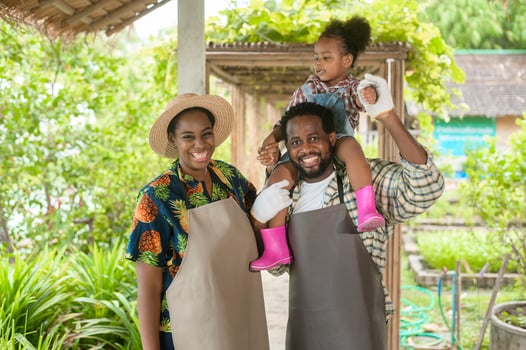 Happy black agronomist family enjoying and working in farmland, agriculture concept photo