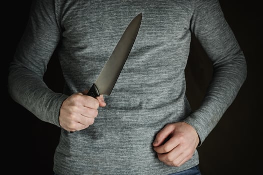 criminal with large sharp knife photo