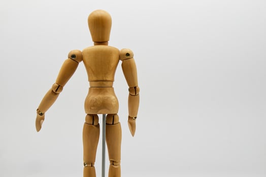 Wooden figure isolated on white background. Wood Figure Mannequin. Space for text. photo