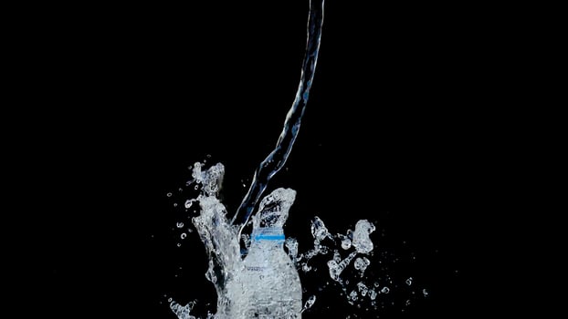Abstract water jet crashes on a black background photo