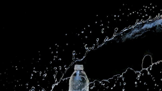 Abstract water jet crashes on a black background photo