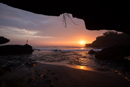 sunset over hindu temple Pura Tanah Lot, Bali, Indonesia photo