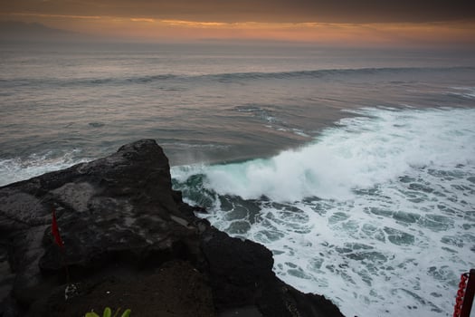 Blue wave at sunset Bali Beach ,Indonesia photo