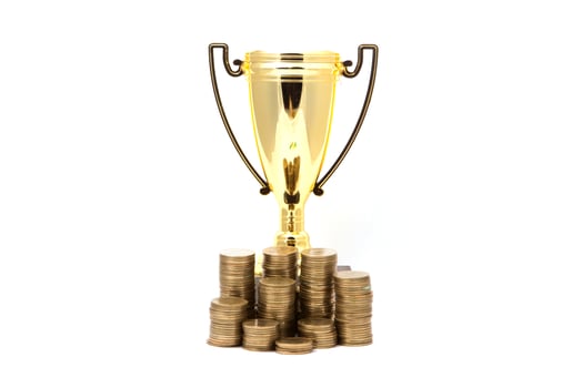 golden winner cup and coins on white background. photo