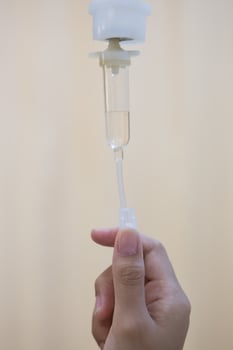 Nurse adjusting IV drip rate photo
