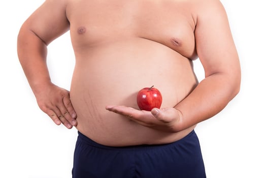 fat man with a apple in his hand photo