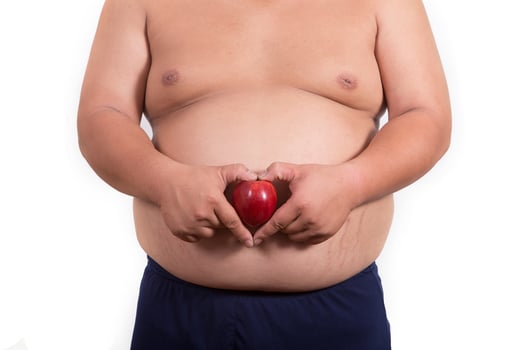 fat man with a apple in his hand photo