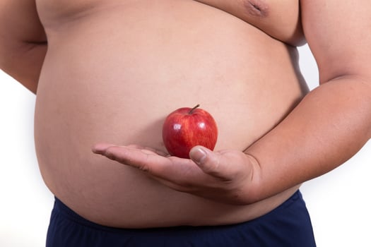 fat man with a apple in his hand photo