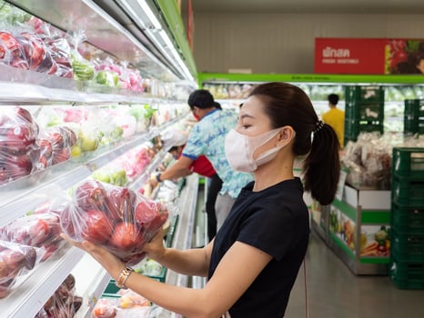 Asian woman wearing protect face mask and rubber gloves shopping food photo