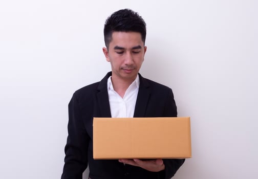 Shop assistant brings the parcel, isolated, white background photo