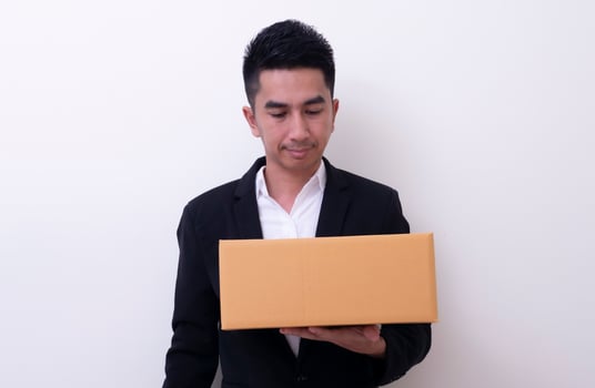 Shop assistant brings the parcel, isolated, white background photo