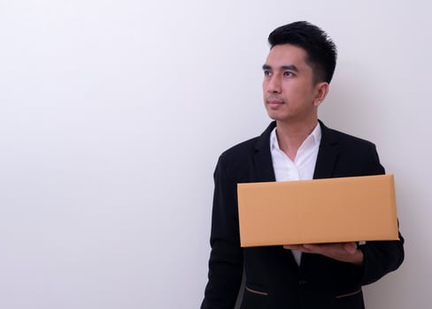 Shop assistant brings the parcel, isolated, white background photo
