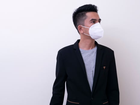 Asian young man and medical mask to protect COVID-19 photo