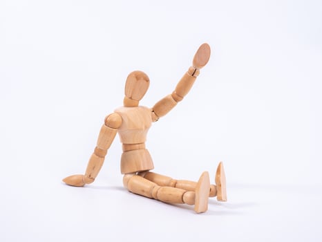The wooden dummy sits on white background photo
