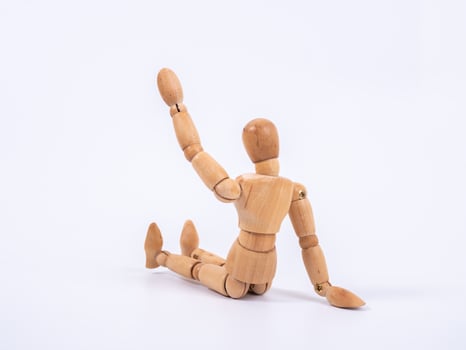 The wooden dummy sits on white background photo