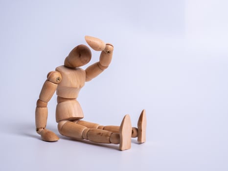 The wooden dummy sits on white background photo