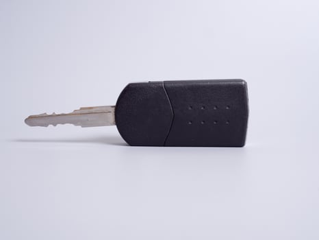 Car key with remote control isolated on gray background. photo