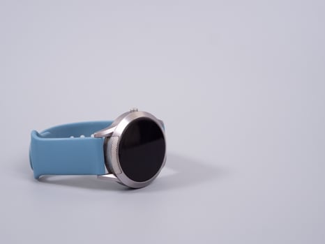 smartwatch placed on a rough gray table photo