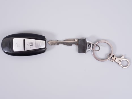 Car key with remote control isolated on gray background. photo