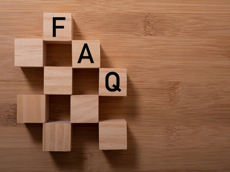 closeup of wooden word on wooden table background concept - FAQ photo