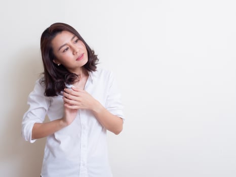 Portrait of young asian woman standing and smiling photo