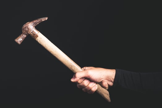 hammer - tools in a man hand - maintenance service concept photo