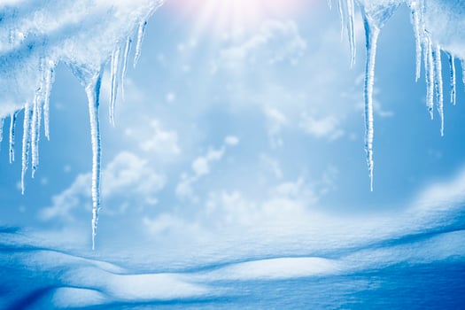 White icicles against the blue winter sky. photo