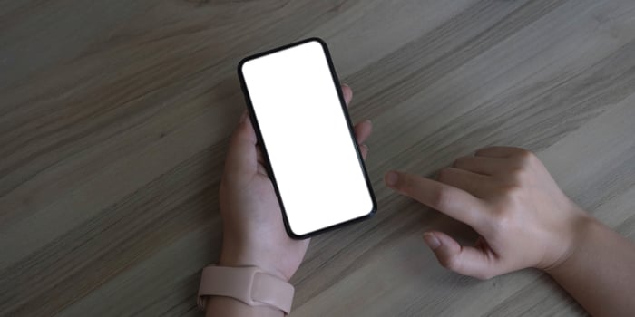cell phone Mockup image blank white screen.woman hand holding texting using mobile on desk at coffee shop.background empty space for advertise text.people contact marketing business,technology photo