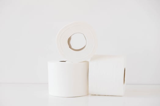 Rolls of white toilet paper on a white background photo