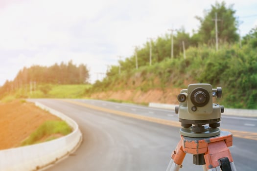 road construction site, theodolite instrument for road construction photo