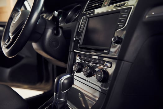 Inside of brand new modern electrical car. Particle view. Cropped photo