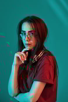 Attractive woman. Studio shot indoors with neon light. Portrait of beautiful young girl photo
