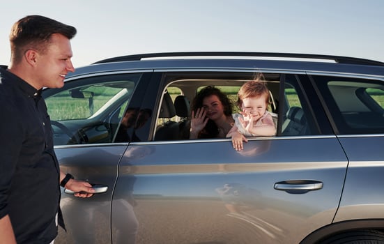 Hello, gesture. Beautiful people is in the modern car at their weekends photo