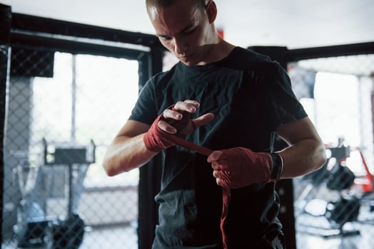 Preparation before the training. Close up shot of young boxer photo