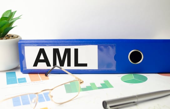 blue file folder with words take AML Anti-Money Laundering . Business concept photo