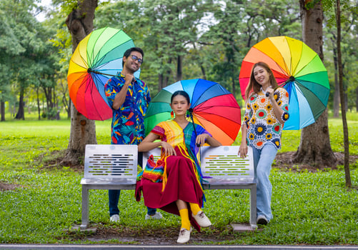 Group of LGBTQ people dressing in colorful clothes gathering in the park for expressing gender fluid, non-binary rights and marriage equality movement concept photo
