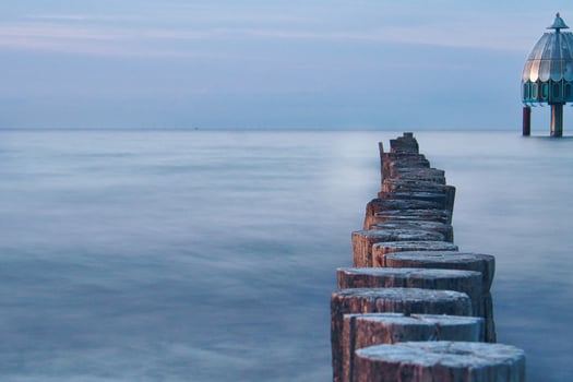 groynes jutting into the sea. taken in zingst on the darss. photo