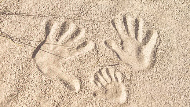 handprints in the sand on the beach of the Baltic Sea. photo