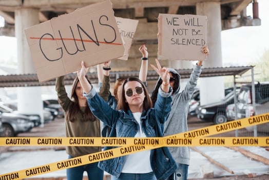 Automobiles behind. Group of feminist women have protest for their rights outdoors photo