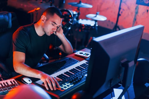 Sound engineer working and mixing music indoors in the studio photo