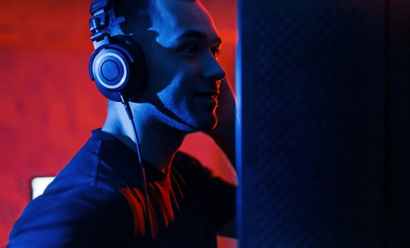Vocalist have recording session indoors in the modern professional studio photo