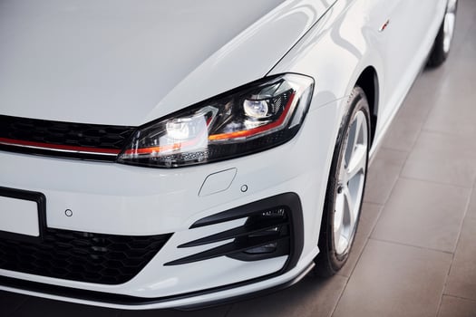 Close up view of brand new white colored polished automobile photo