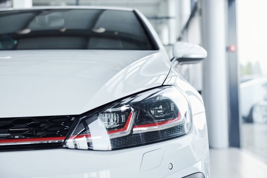 Close up view of brand new white colored polished automobile photo