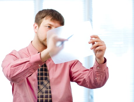 man writes on white photo