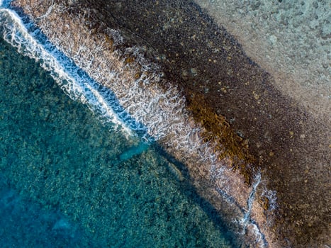 aerial view of waves on reef of polynesia Cook islands photo