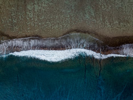 Rarotonga waves on the reef Polynesia Cook Island tropical paradise aerial view photo