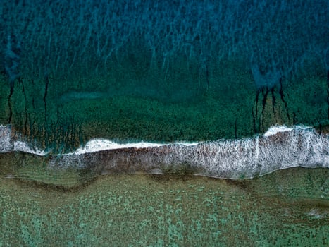 aerial view of waves on reef of polynesia Cook islands photo