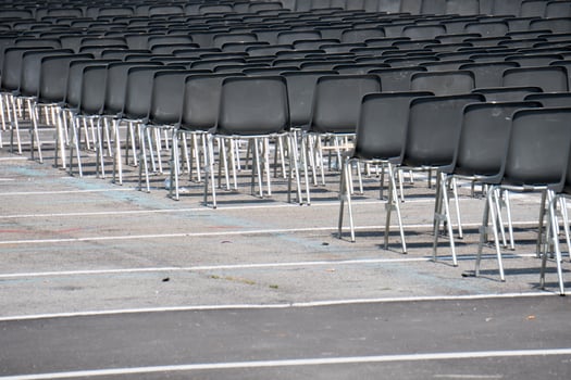 Many empty chairs without audience photo